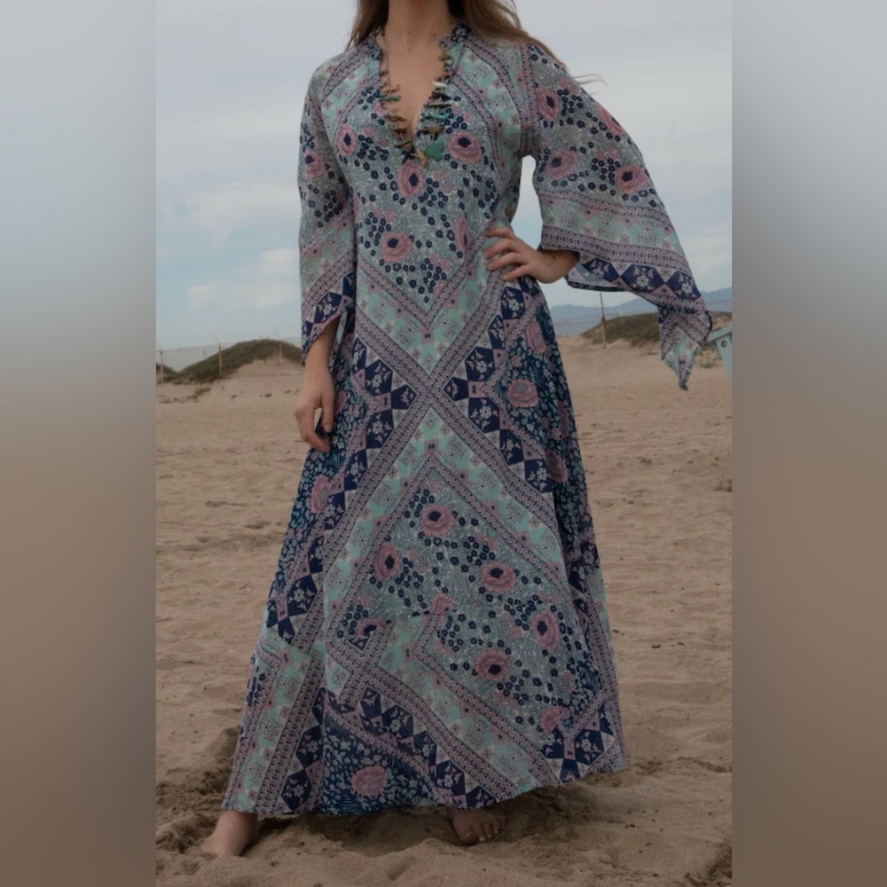 Vintage inspired hippie dress with bell sleeve and flowy silhouette.